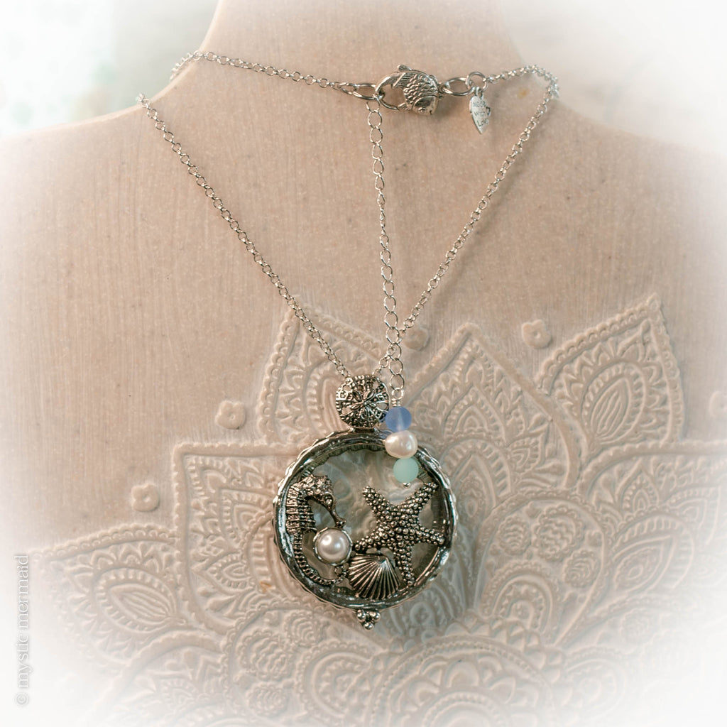 Seahorse of Serenity and a Starfish Wish Magnifying Glass Necklace