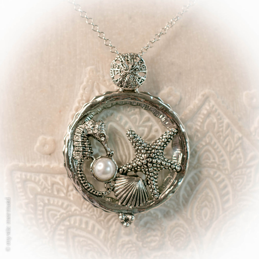 Seahorse of Serenity and a Starfish Wish Magnifying Glass Necklace